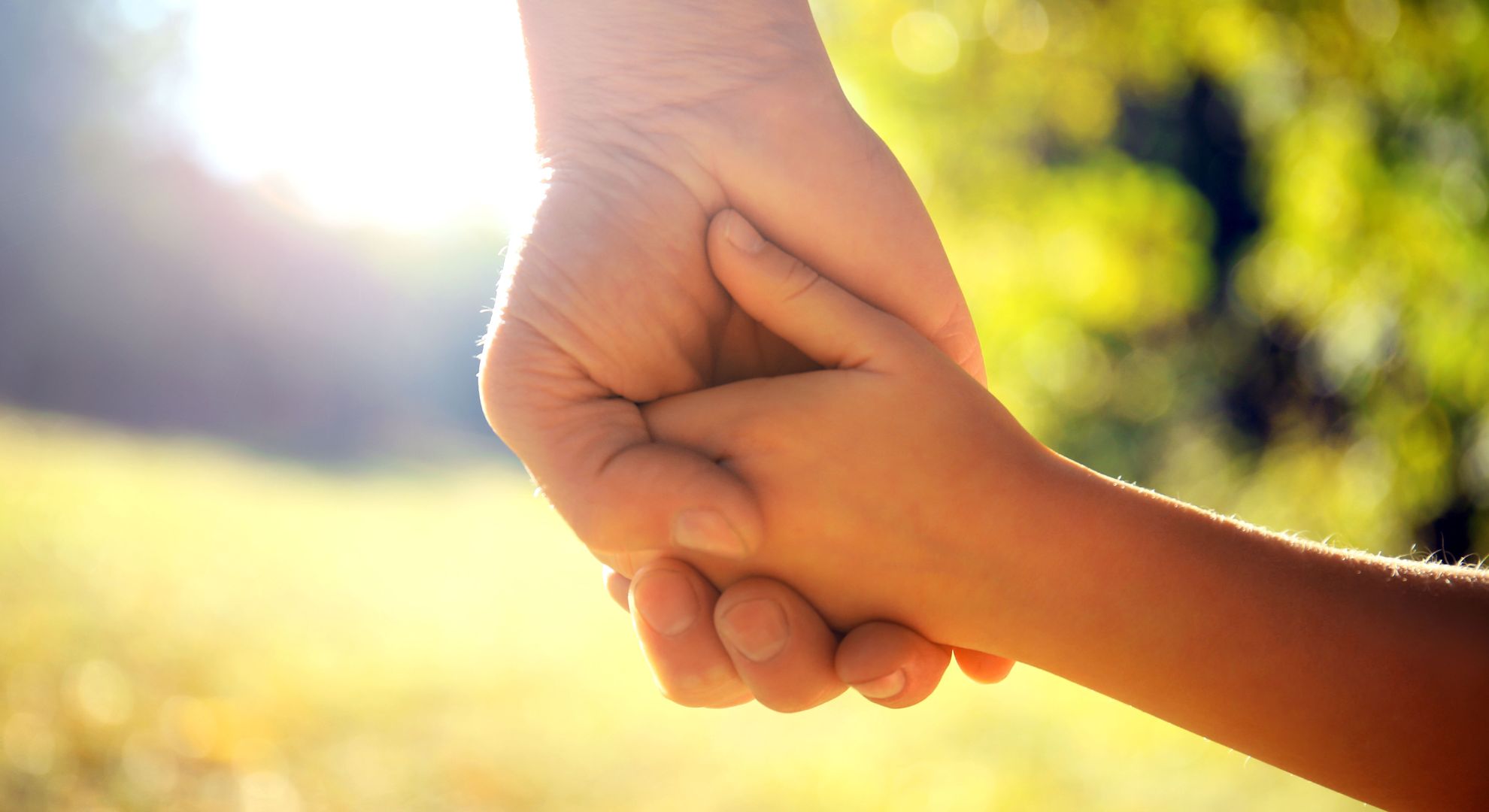 child holding their parent's hand