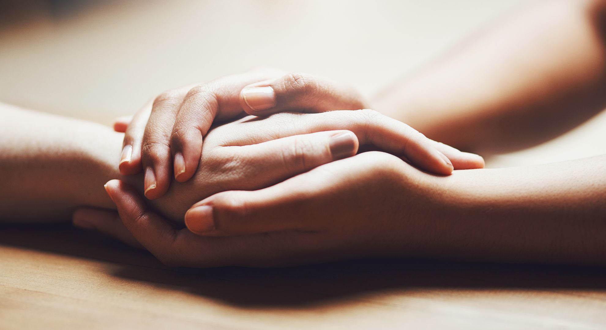 person holding another person's