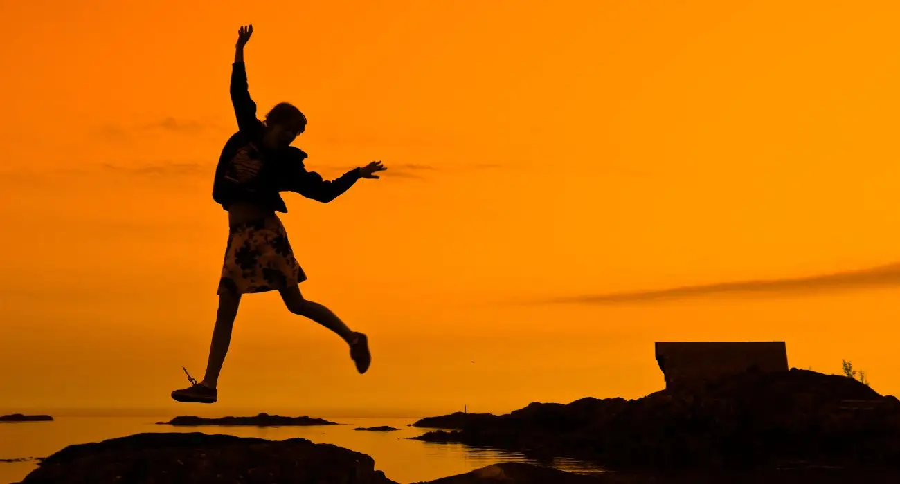 silhouette of a person against a sunset