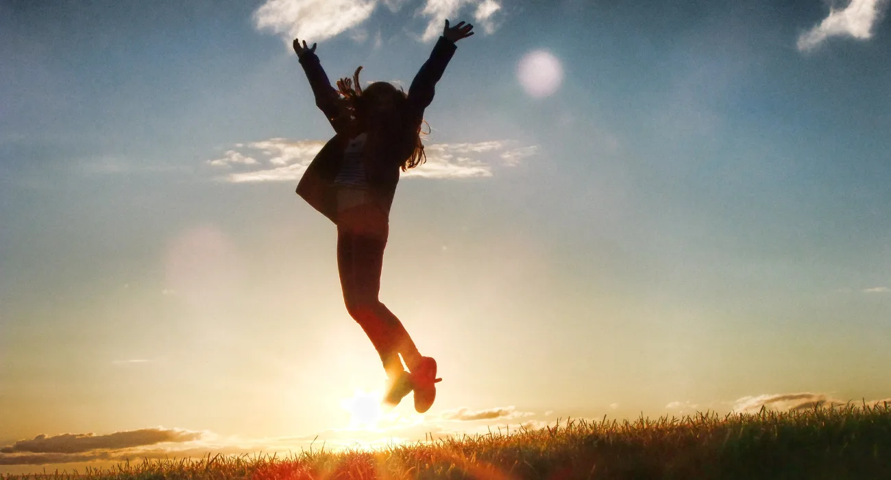 a person happy jumping in air