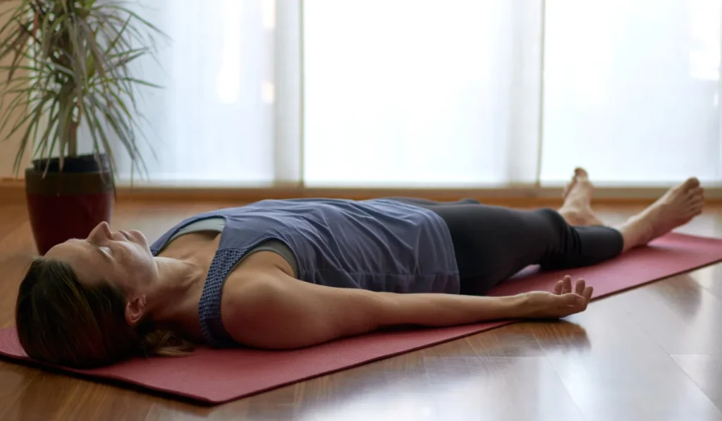 A person perofrming yoga nidra