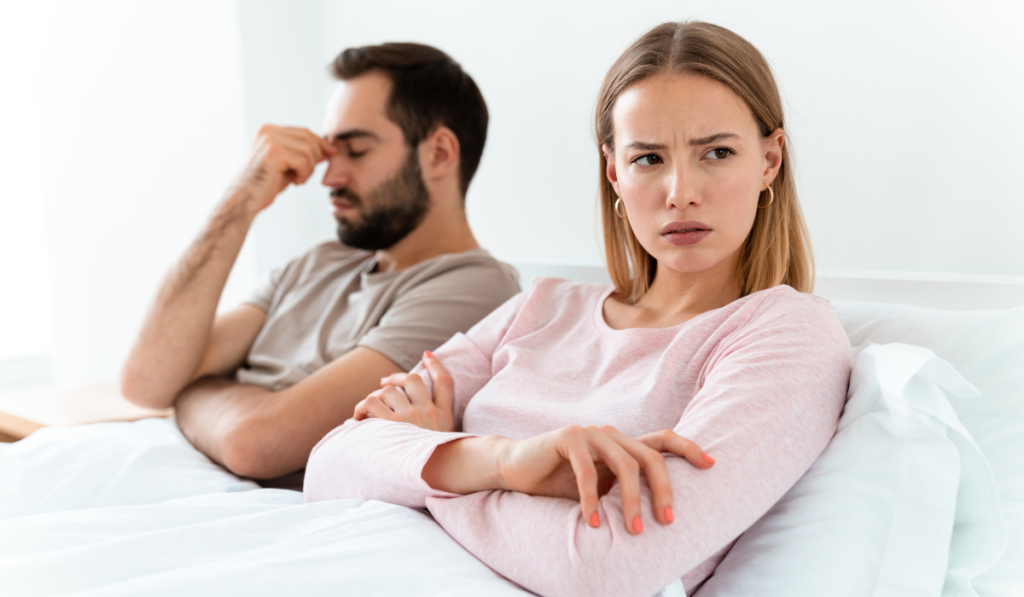 couple irritated with each other and turning their faces away from each other.