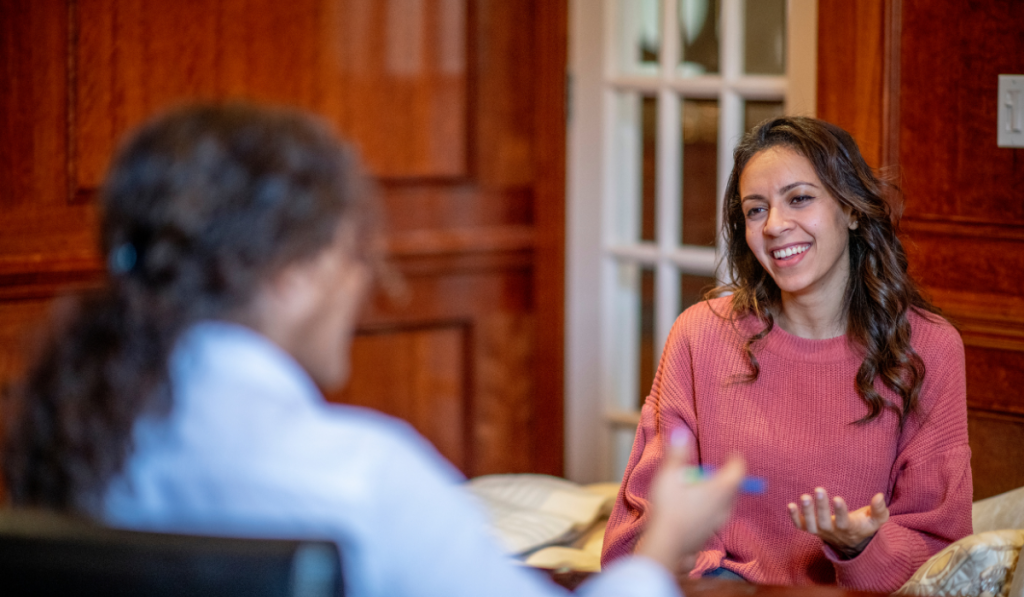 woman having a conversation and smiling